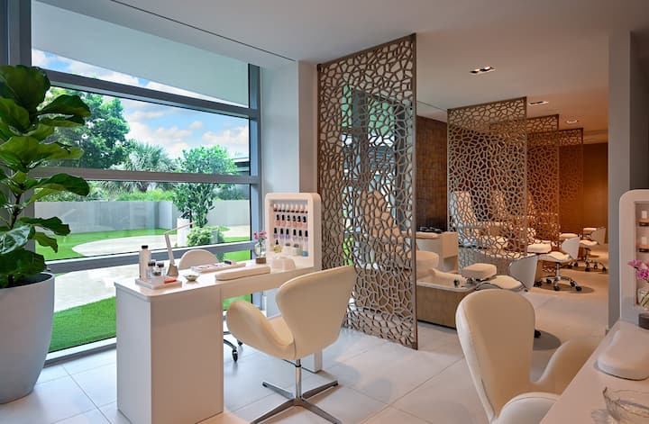 The spa reception and relaxation lounge with a carved screen