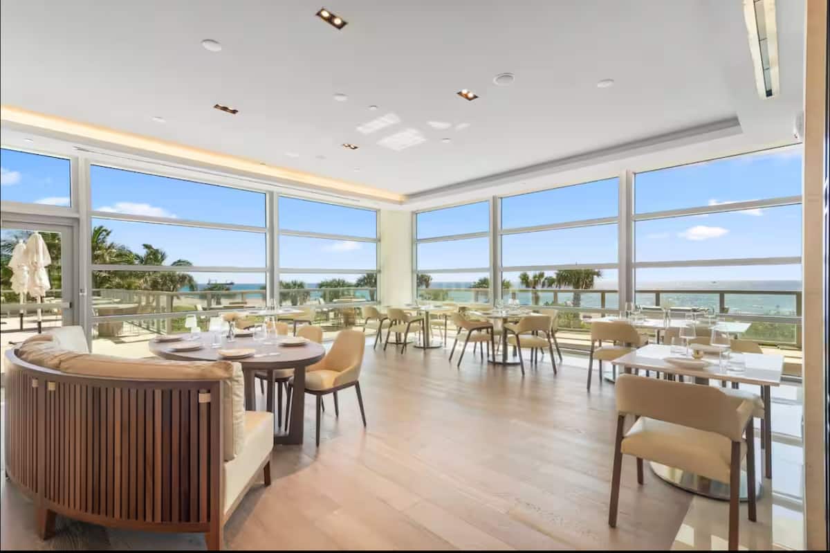 A cafe-style lounge with ocean windows