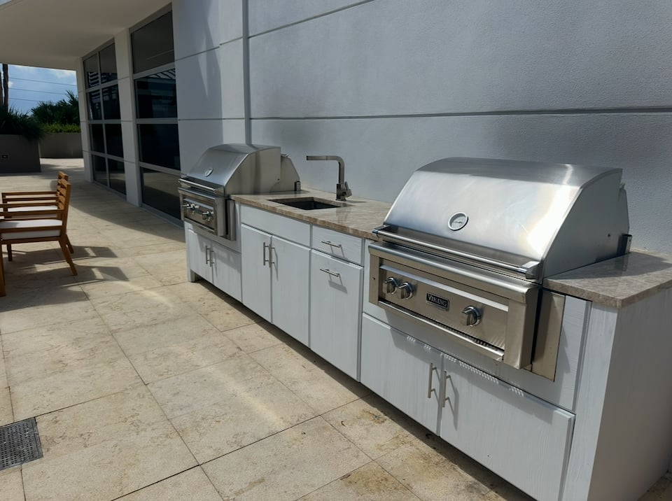The outdoor kitchen and grill on the social terrace