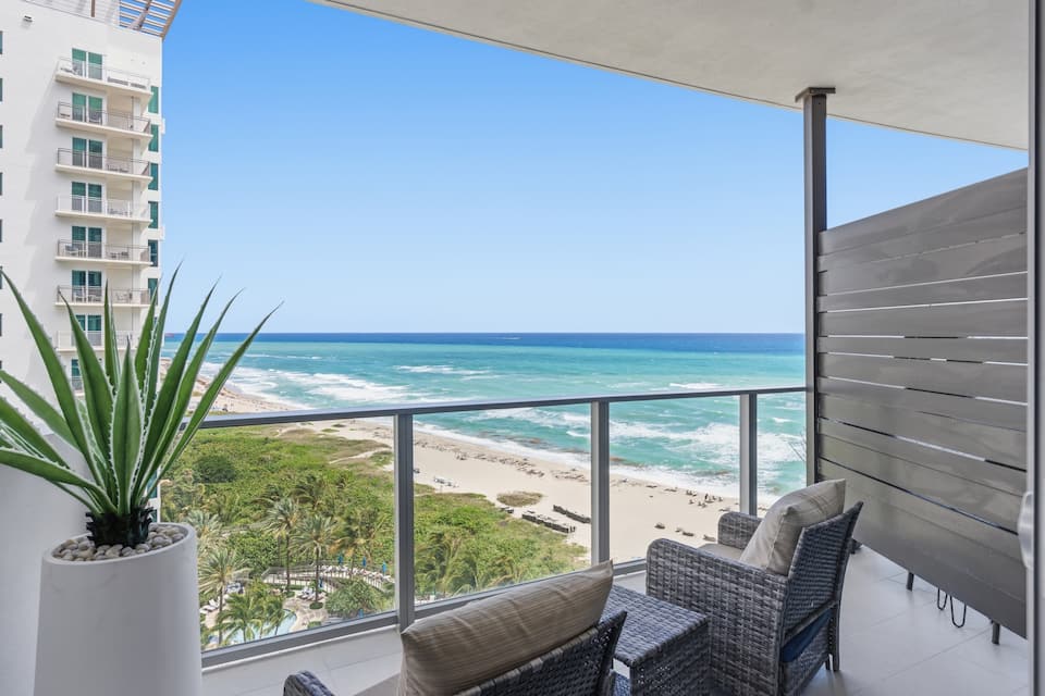 The balcony overlooking the beach with the resort pool below