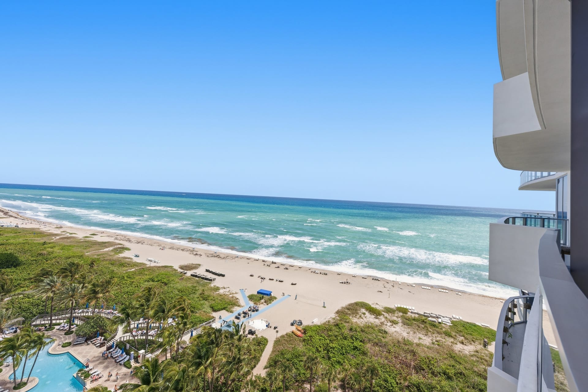 Aerial view along the Singer Island coastline and resort pool