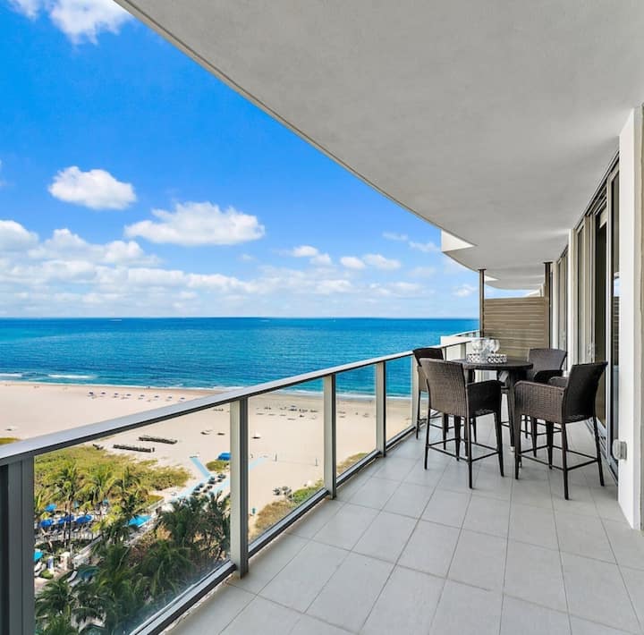 The curved balcony running the width of the residence, the beach far below
