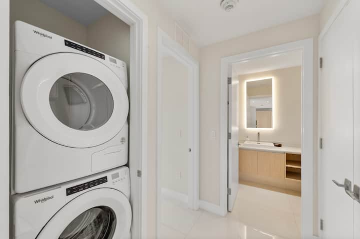 The in-residence laundry closet with a stacked washer and dryer